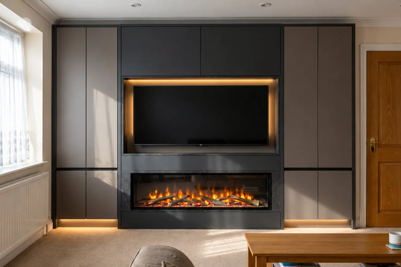 The same wall after a bespoke media wall with fireplace and lighting is installed